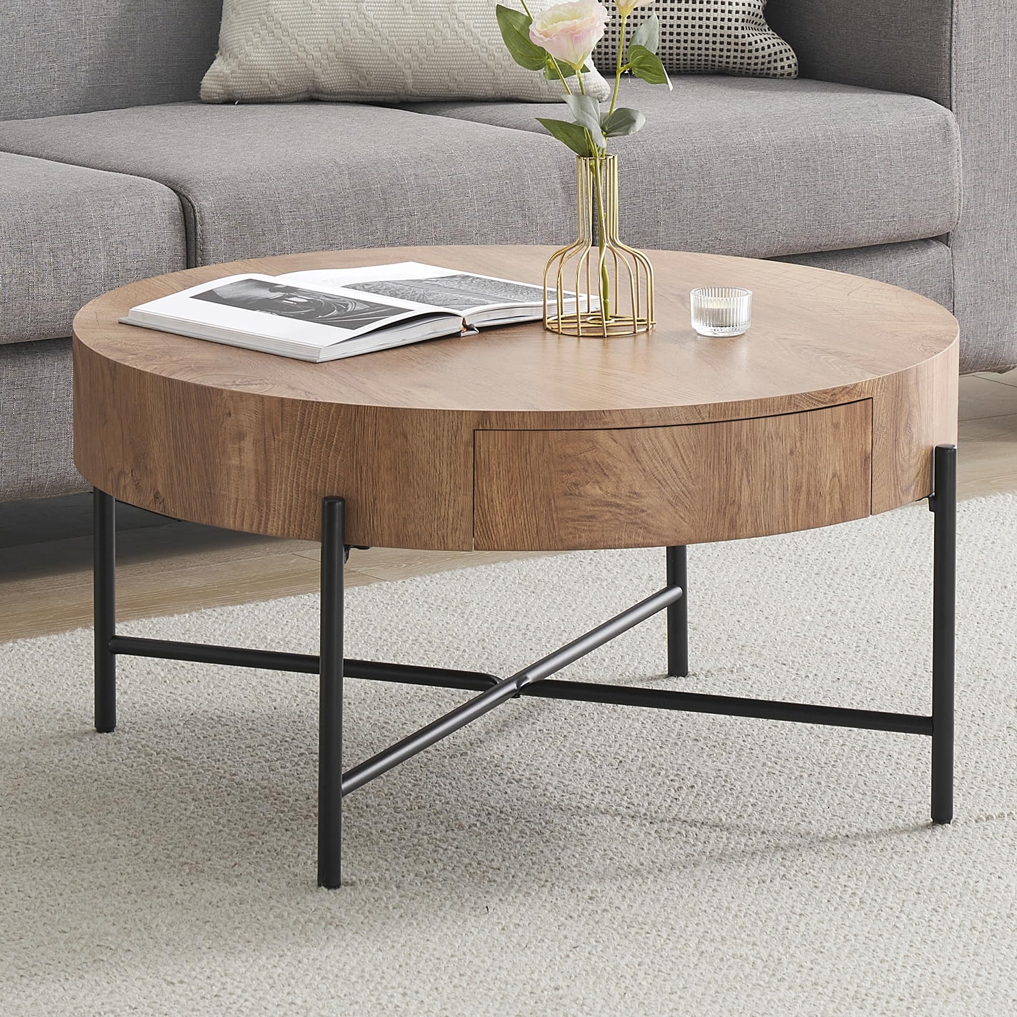 Round Accent Coffee Table with Vase on Rug in Contemporary Living Space
